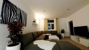 A television and/or entertainment centre at Le Monde Apartment Bratislava - amazing 5BDR in downtown