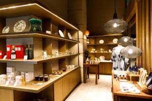 a shop with a display of items on shelves at Glamday Style Okinawa Yomitan Hotel & Resort in Yomitan