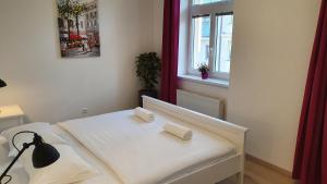 A bed or beds in a room at Le Monde Apartment Bratislava - amazing 5BDR in downtown