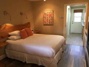 a bedroom with a large white bed in a room at Cambria Shores Inn in Cambria +97 photos