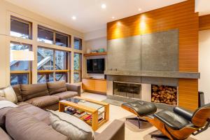 a living room with a couch and a fireplace at 05 Forest Creek in Whistler