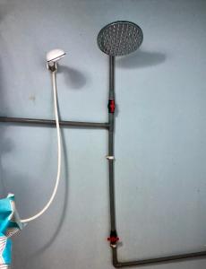 a hair dryer is attached to a wall at Beachfront Hut Upstairs Astra - Beach Shack Chalet in Tioman Island