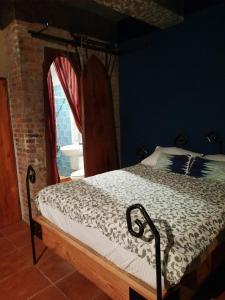 a bedroom with a bed and a window at Sleepy Buffalo in Donghe