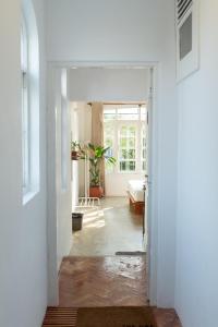 a hallway leading to a living room with a window at Srilax in Colombo