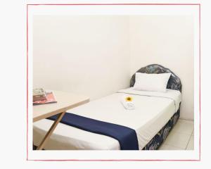 Ein Bett oder Betten in einem Zimmer der Unterkunft Hotel Olympic
