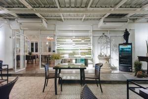 a dining room with a table and chairs at Loei Palace Hotel in Loei