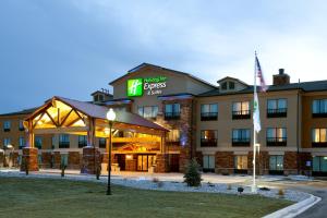 a hotel with a sign on the front of it at Holiday Inn Express Hotel & Suites Lander, an IHG Hotel in Lander