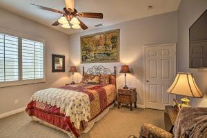a bedroom with a bed and a ceiling fan at Indio Casita 2 Mi to Coachella and Stage Coach! in Indio +17 photos