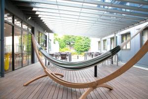 a hammock on a deck in a building at Narita AIC Airport Hotel in Narita +44 photos