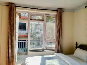 Ένα ή περισσότερα κρεβάτια σε δωμάτιο στο Beehive Hostel Kathmandu
