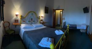 Posteľ alebo postele v izbe v ubytovaní Hotel Ficocle