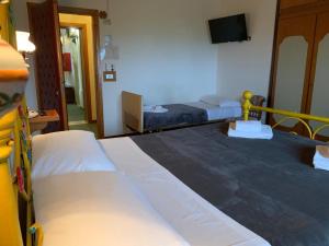 Posteľ alebo postele v izbe v ubytovaní Hotel Ficocle