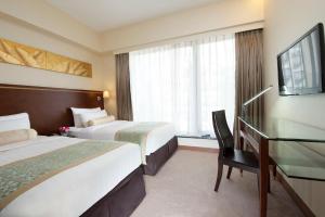 Llit o llits en una habitació de Brighton Hotel Hong Kong