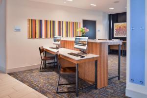 an office with two computers on a desk at Holiday Inn Express & Suites - Olathe West by IHG in Olathe