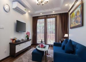 TV a/nebo společenská místnost v ubytování Hanoi Central Hotel & Residences