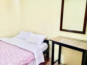Ένα ή περισσότερα κρεβάτια σε δωμάτιο στο Beehive Hostel Kathmandu