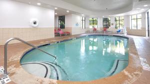a swimming pool in a hotel room with a pool at Holiday Inn Hotel & Suites Stockbridge-Atlanta I-75, an IHG Hotel in Stockbridge
