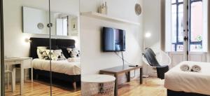 Łóżko lub łóżka w pokoju w obiekcie LEEWAYS LOFT in FUENCARRAL