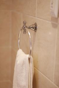 a towel hanging on a towel rack in a bathroom at Komani Resorts in Queenstown