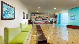 a living room with a couch and a table at Ras Al Jinz Turtle Reserve in Sur