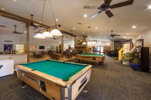a room with a pool table and some tables at Holiday Inn Club Vacations Holiday Hills Resort at Branson in Branson