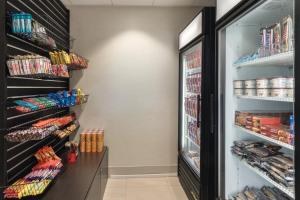 a refrigerator filled with lots of food and drinks at Holiday Inn Express Hotel & Suites Lawton-Fort Sill, an IHG Hotel in Lawton