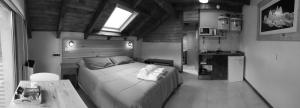 a bedroom with a bed and a table and a window at Campo Base Aparts in El Chalten +51 photos