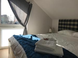 Posteľ alebo postele v izbe v ubytovaní Apartamenty Zastava Włoszczowa