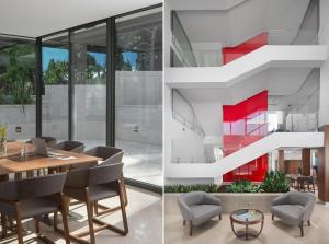 a dining room with a staircase and a table and chairs at Hotel Milan in Pula