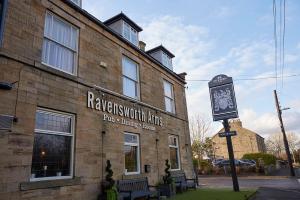 a brick building with a clock on the front of it at Ravensworth Arms by Chef & Brewer Collection in Gateshead