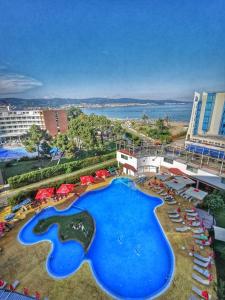 an aerial view of a resort with a large swimming pool at Hotel Colosseum in Sunny Beach