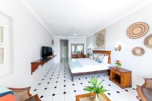 Katil atau katil-katil dalam bilik di Palm Beach Hotel