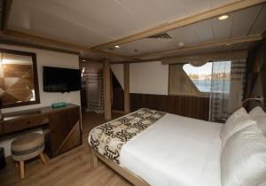 Letto o letti in una camera di SUNRISE Mahrousa Cruise