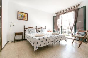 Ένα ή περισσότερα κρεβάτια σε δωμάτιο στο El Niu