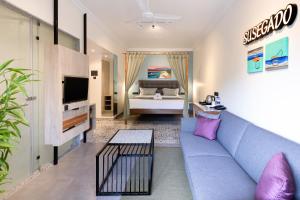 TV a/nebo společenská místnost v ubytování Regenta Inn Palacio De Goa, Panjim