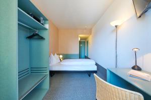 Postel nebo postele na pokoji v ubytování Hotel City am Bahnhof