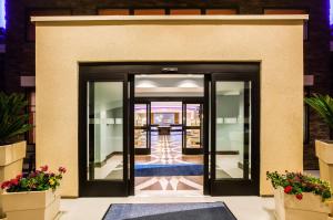 a door that is open to a room with a view of a building at Holiday Inn Express & Suites Eureka, an IHG Hotel in Eureka