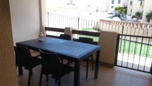 a blue table and chairs on a balcony at Matheo Palomares in Palomares