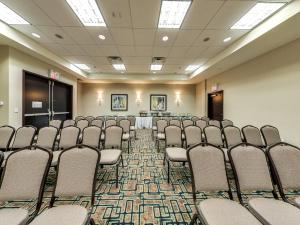 a conference room with chairs and tables in it at Holiday Inn Hotel & Suites Edmonton Airport Conference Centre by IHG in Nisku +51 photos