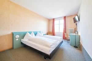 Postel nebo postele na pokoji v ubytování Hotel City am Bahnhof