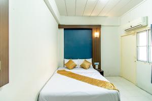 Postel nebo postele na pokoji v ubytování Riski Residence Bangkok-noi - Wasit Apartment