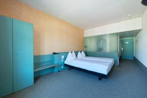 Postel nebo postele na pokoji v ubytování Hotel City am Bahnhof + 37 fotografií