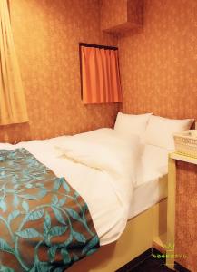 Krevet ili kreveti u jedinici u okviru objekta Nishifunabashi Ekimae Hotel
