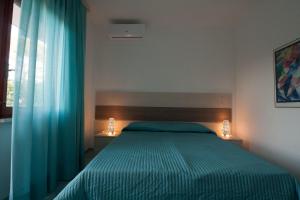 Katil atau katil-katil dalam bilik di Capri Apartment
