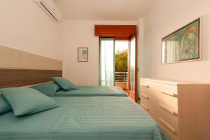 Katil atau katil-katil dalam bilik di Capri Apartment