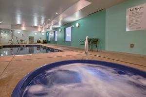 a swimming pool with water in the middle of a room at Holiday Inn Express & Suites Carlisle, an IHG Hotel in Carlisle