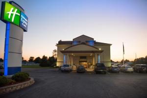 a gas station with cars parked in a parking lot at Holiday Inn Express Hotel & Suites Wauseon, an IHG Hotel in Wauseon