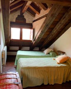A bed or beds in a room at LA DEHESILLA