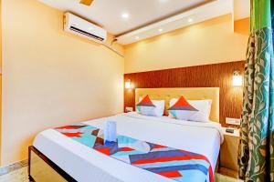 a hotel room with a bed in a room at FabExpress Step Inn - Nr Biswa Bangla Gate in Kolkata