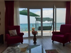 a living room with a view of the ocean at Trabzon Sea Palace in Trabzon